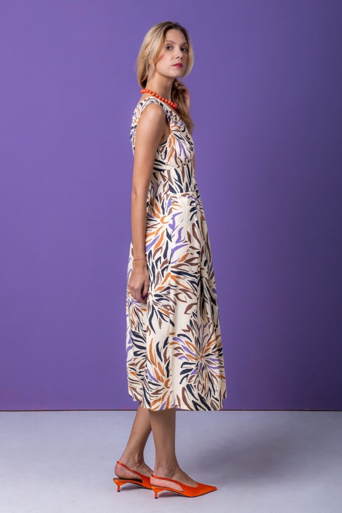 The sleeveless midi dress features an eye-catching colorful pattern made from modal fiber.